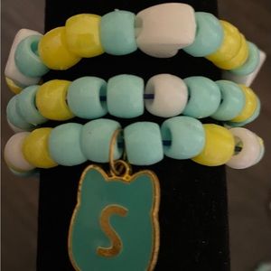 Bracelet set of three, blue and yellow themed.